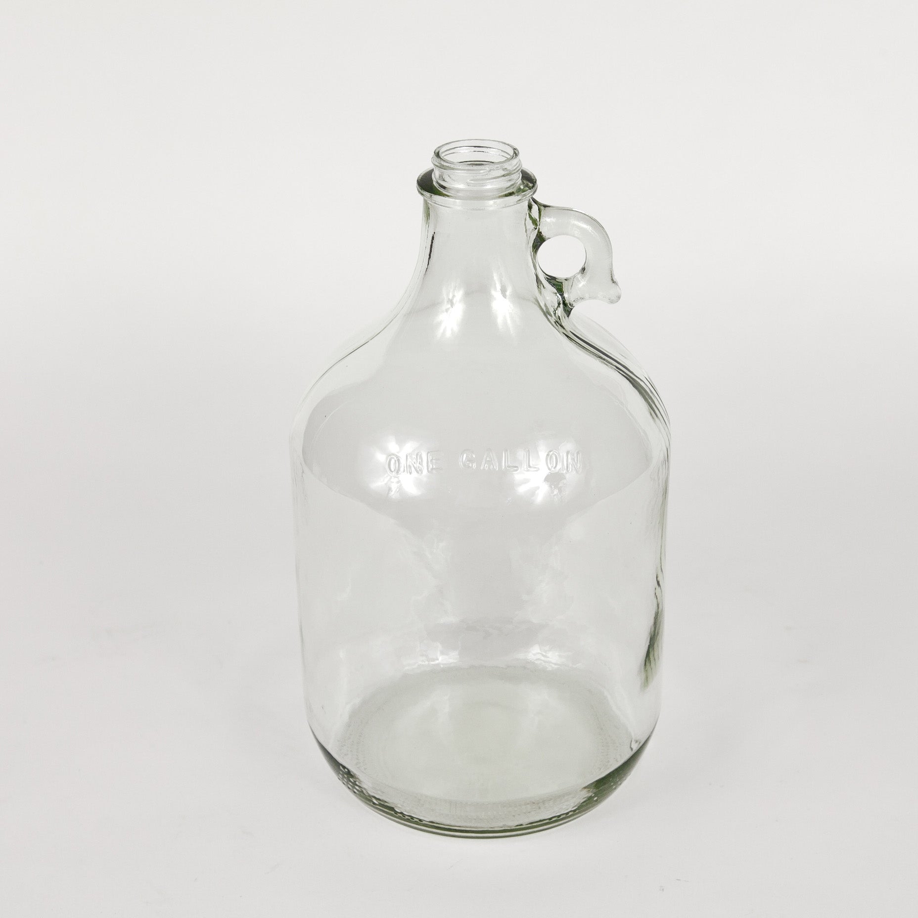 Clear one gallon glass jug